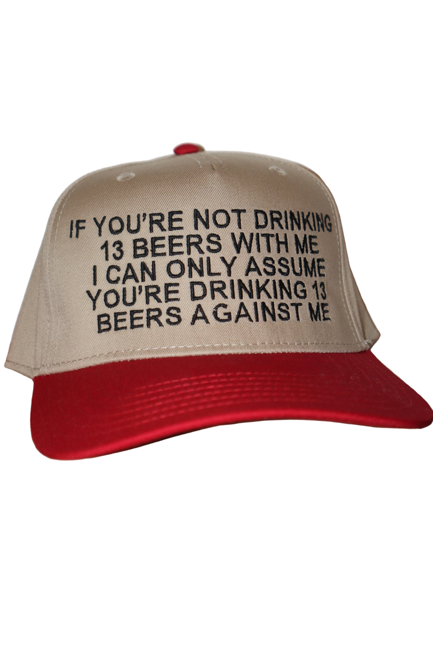 Beige and red cap with humorous text on a white background